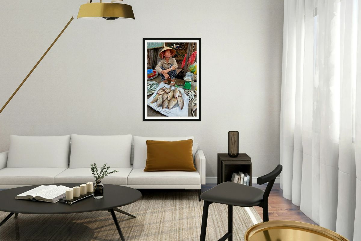 Fish seller sits by market stall in Phu Quoc Vietnam