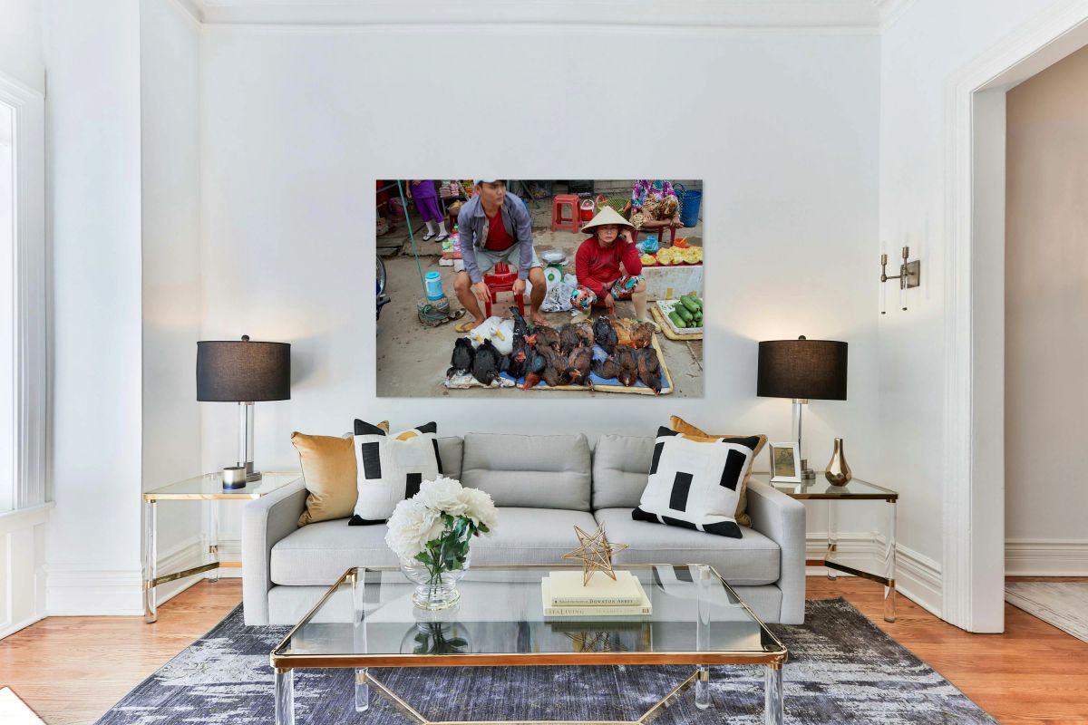 Local market in Phu Quoc with people selling poultry