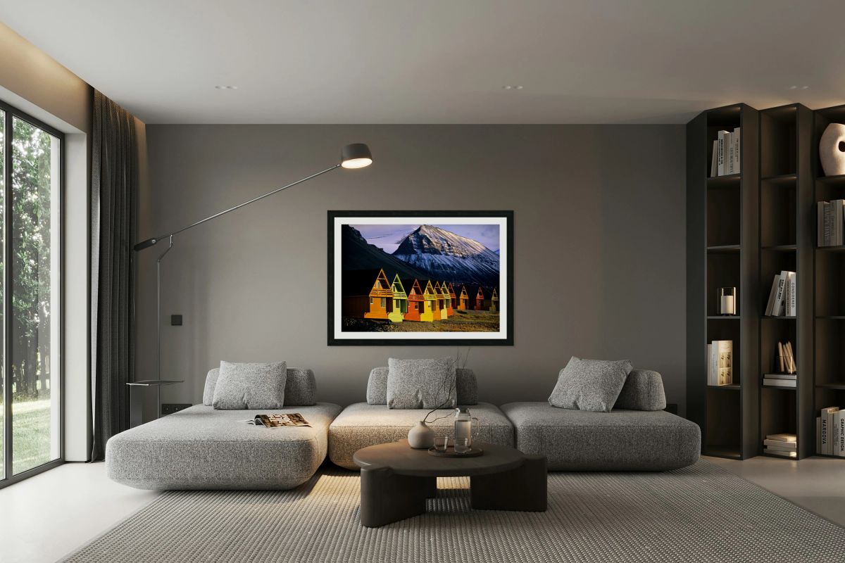 Colorful cabins in Longyearbyen Svalbard near snowy mountains