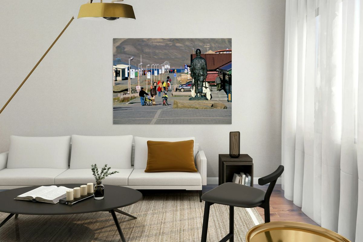 Streets of Longyearbyen with people and a statue