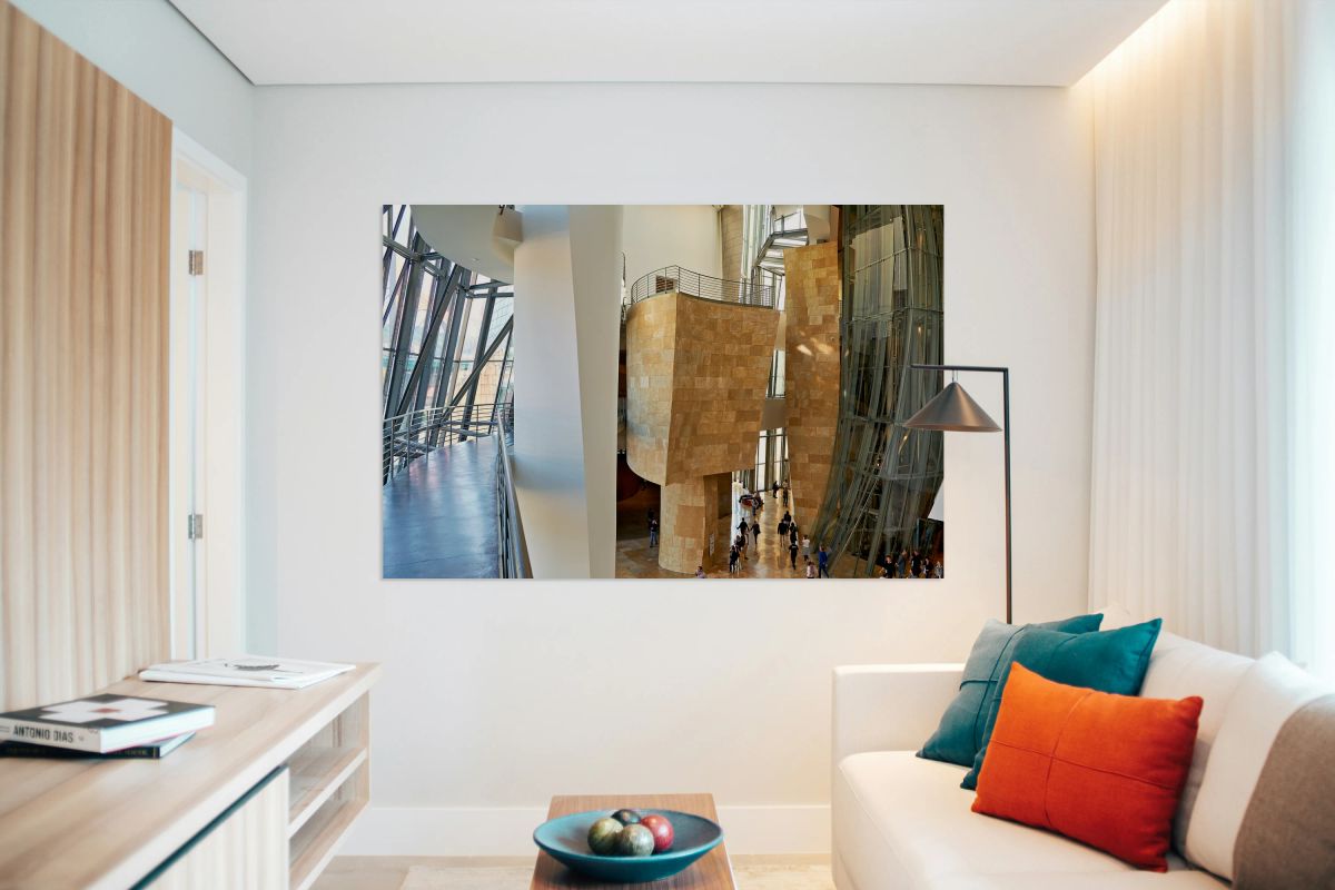 Inside Guggenheim Museum in Bilbao Spain with visitors walking