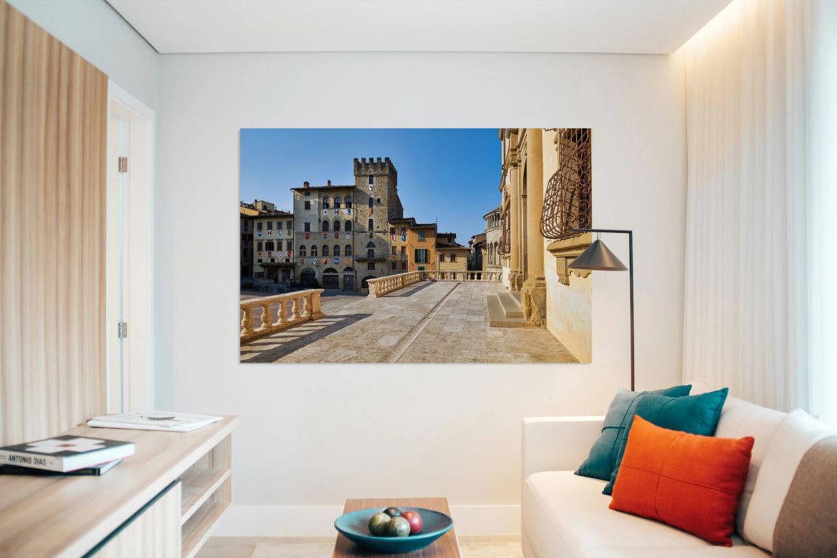People walk through Piazza Grande in Arezzo Italy