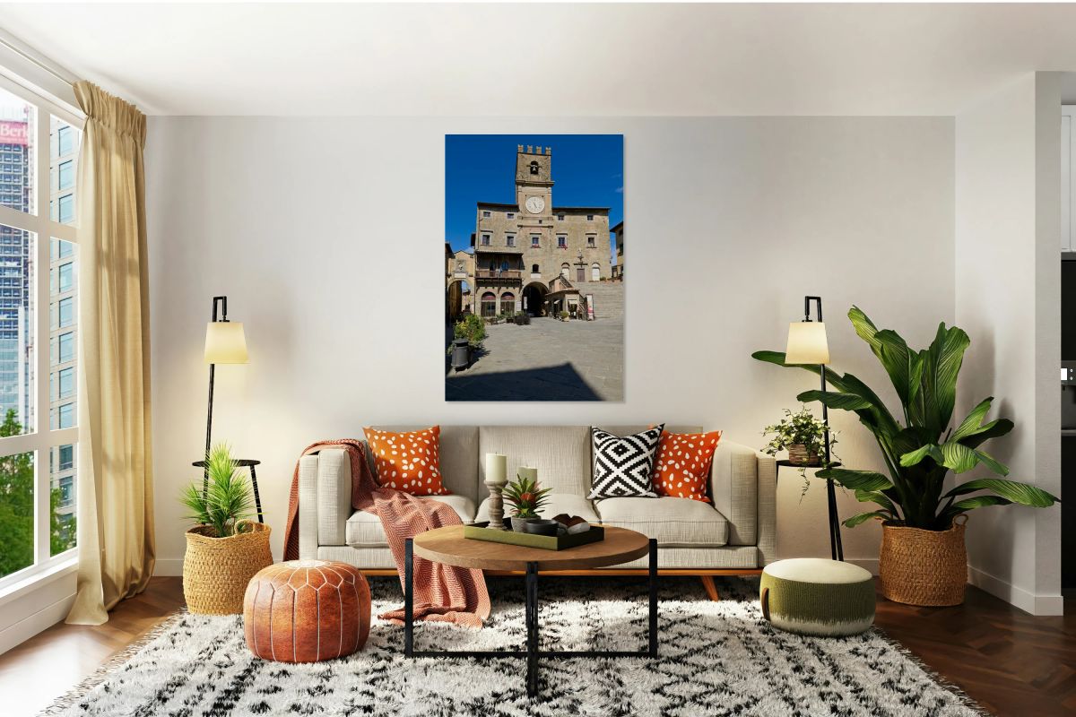 People visit Piazza della Repubblica in Cortona during sunny day