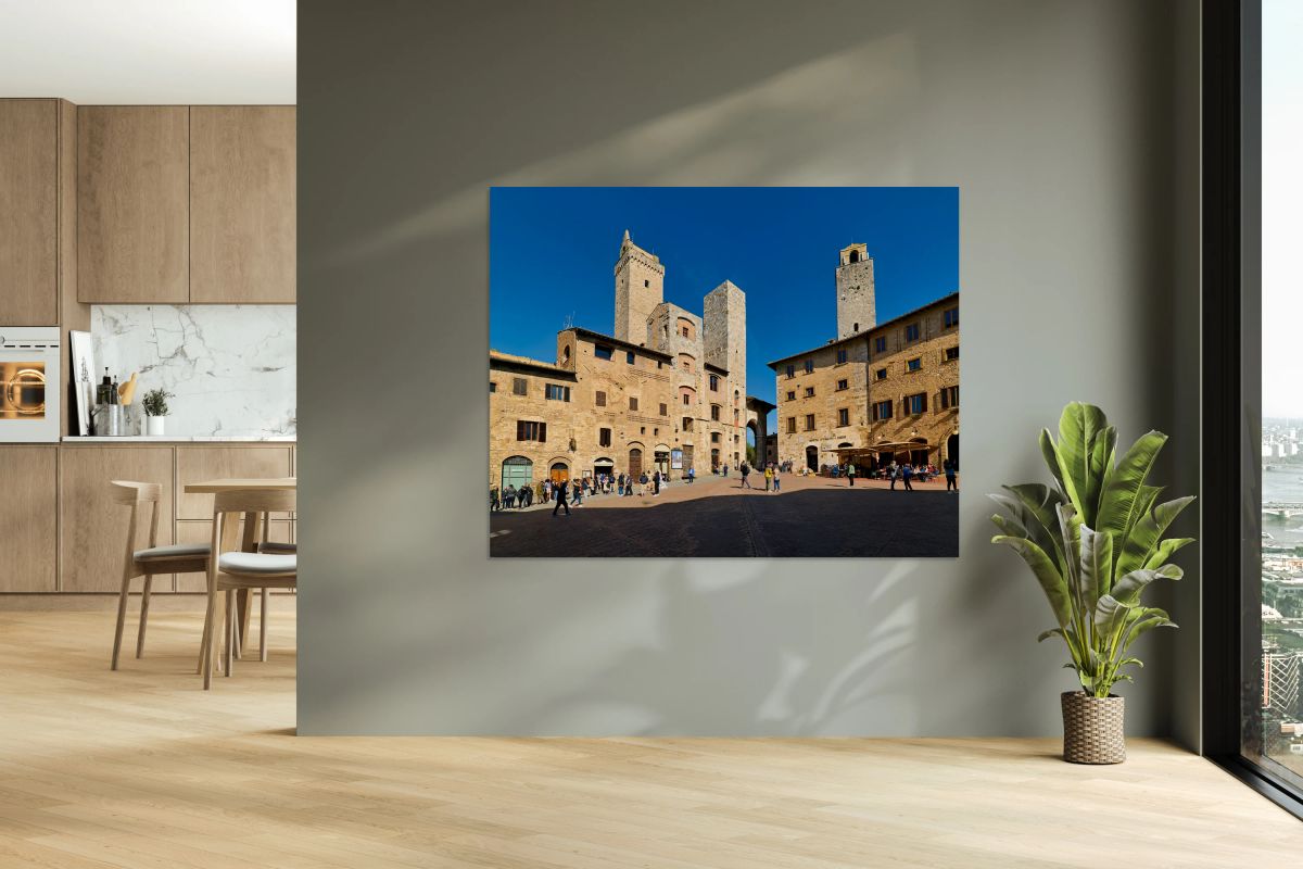 Visitors explore Piazza della Cisterna in San Gimignano