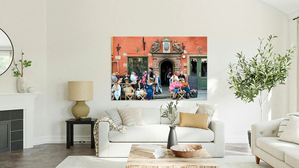 People resting in a cafe at Stortorget square in Gamla Stan