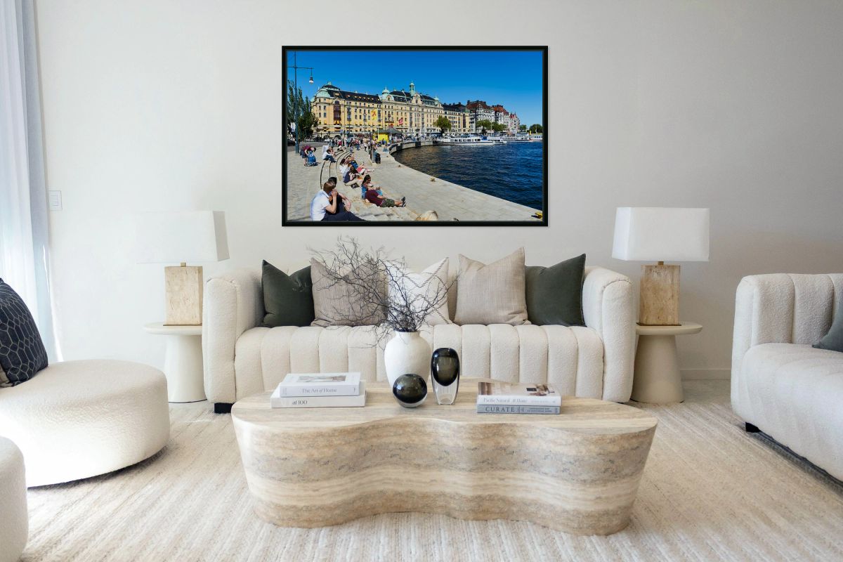 People enjoy sunny day by water in downtown Stockholm