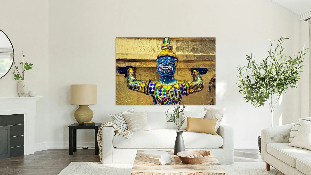 Statue at Wat Phra Kaew in Bangkok holds up structure