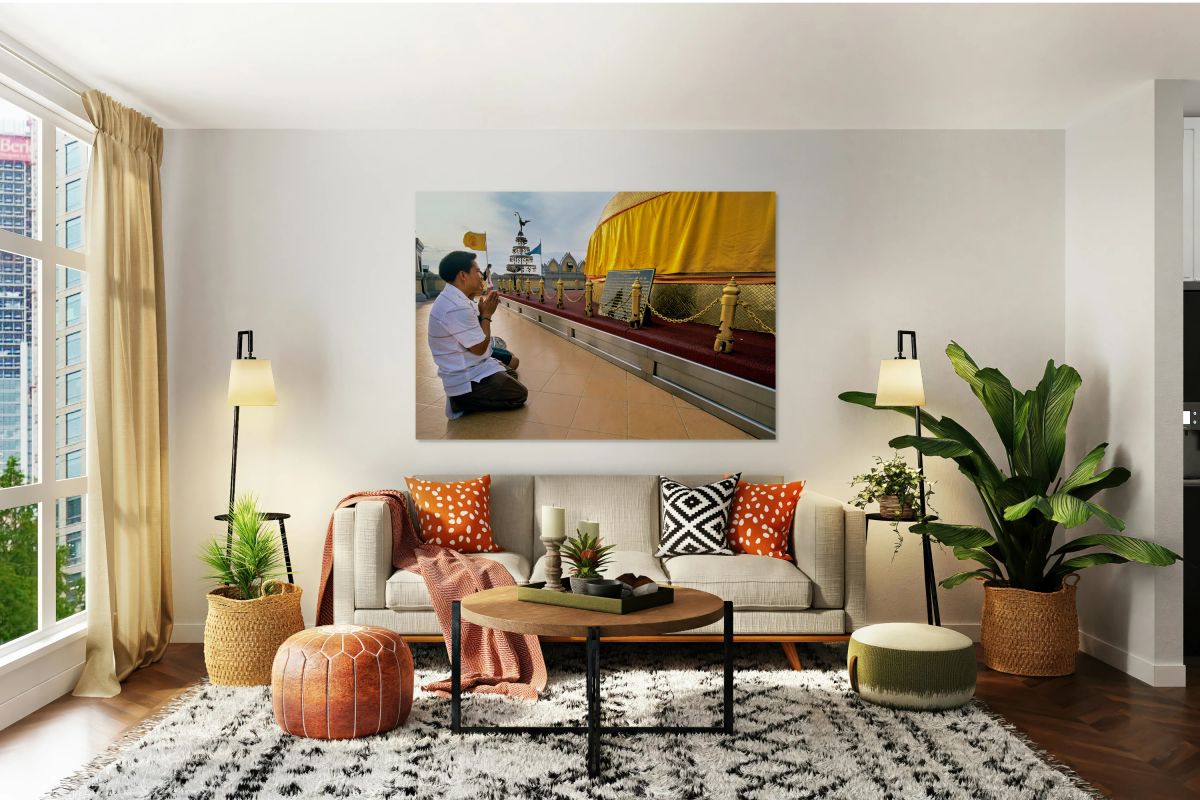 Visitor prays at Wat Saket Golden Mount in Bangkok Thailand