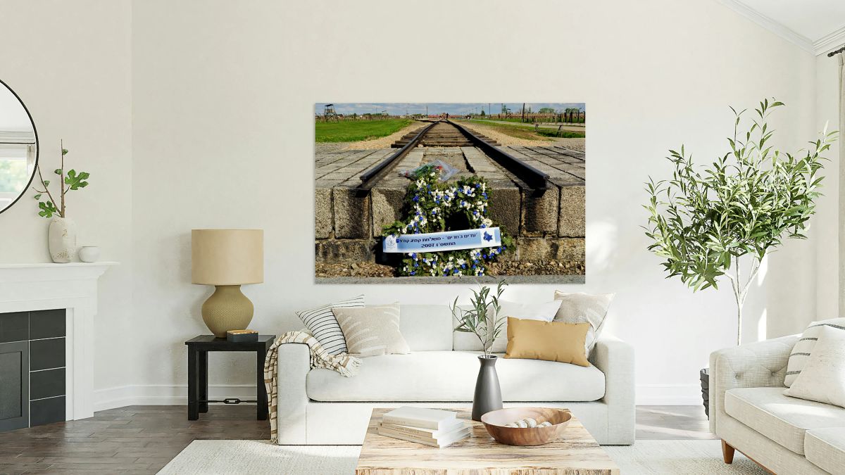 Wreath placed at railroad tracks in Auschwitz concentration camp