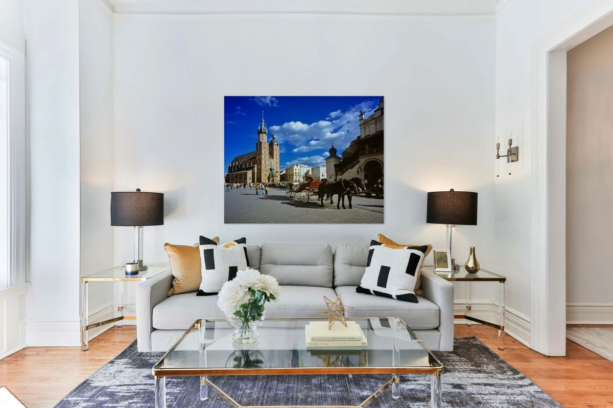 Krakow main square with horse carriage on a sunny day