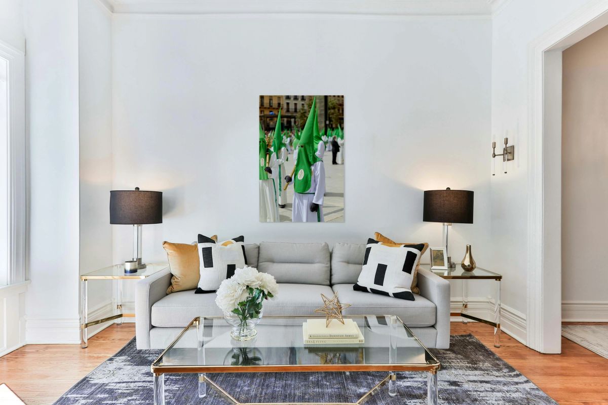 Easter procession in Zaragoza with participants in green hoods