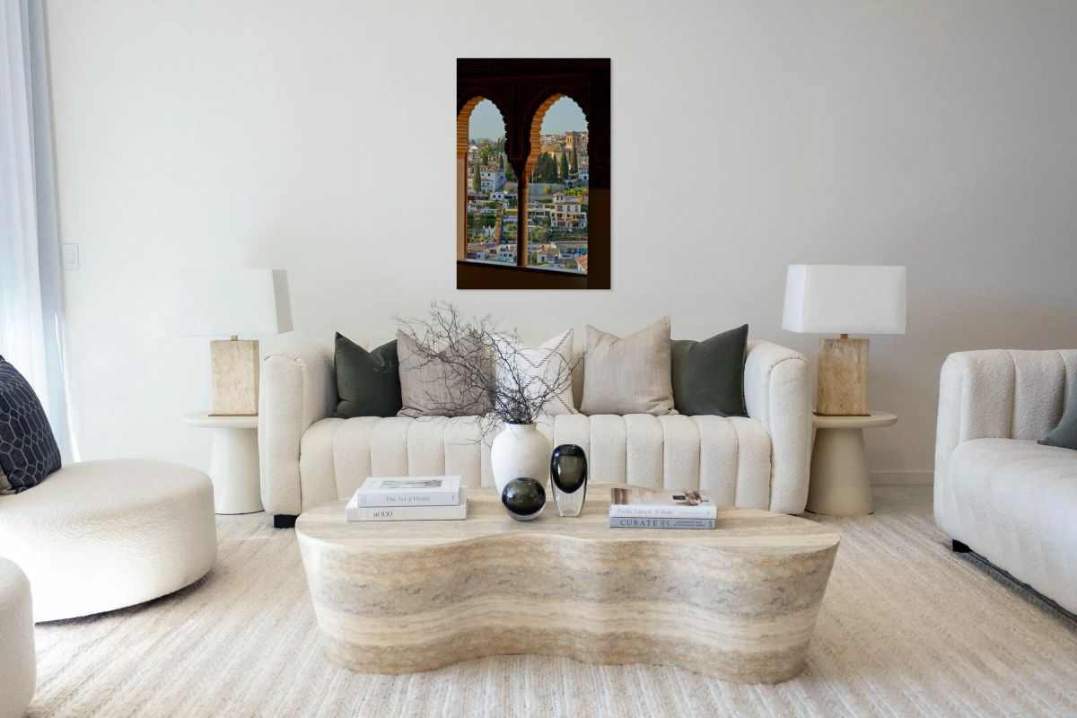 View of Granada cityscape through arches in Andalusia