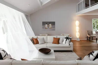 Two Gentoo penguins at Bluff Cove on Falklands walking to ocean Reproduction