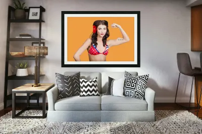 Pinup girl flexing biceps muscle. Bodybuilding Reproduction