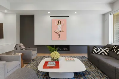 Beautiful fifties pin up girl smiling on swing Reproduction