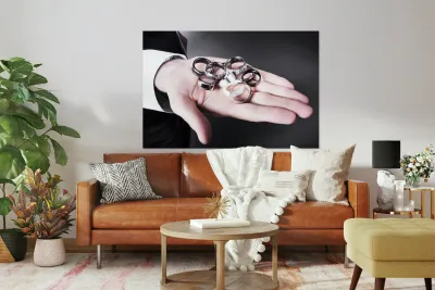 Man displaying a selection of stylish rings Reproduction