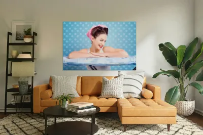 Happy 60s pinup housewife on blue ironing board Reproduction