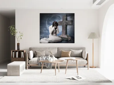 Grieving gothic girl crying next to gravestone Reproduction