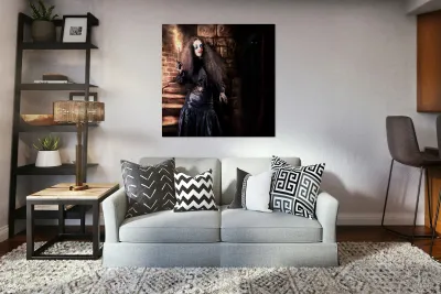 Female jester walking inside dark castle stairwell Reproduction