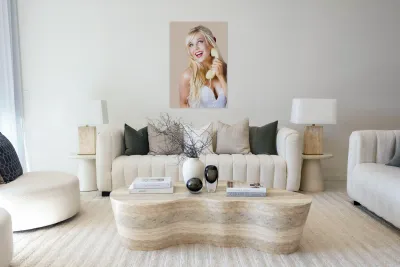 Gorgeous blond woman laughing on telephone call Reproduction