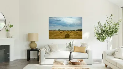 Hay Bales Under a Cloudy Sky Reproduction