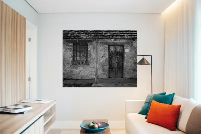 Rustic San Juan Mission building with an aged stone facade. Reproduction