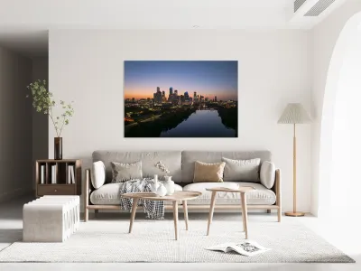 Orange skies behind skyline of Austin Texas as sun starts to ris Reproduction