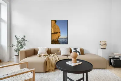 Sea kayaking under sculpted sandstone cliffs Reproduction