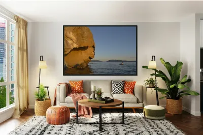 Sea kayaking under sculpted sandstone cliffs Reproduction