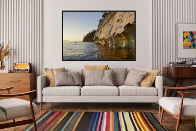 Sea kayaking under the sculpted sandstone cliffs Reproduction