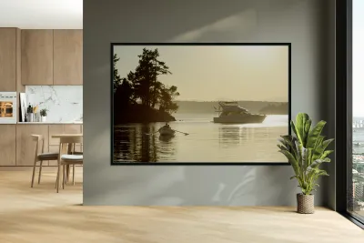 Couple in a dinghy rowing in front of a pleasure motorboat Reproduction