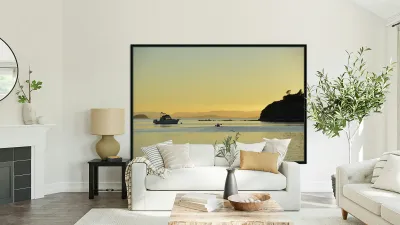 Kayaker and motor boat at anchor in Fox Cove. Sucia Island Reproduction