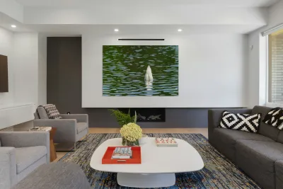 Rear view of the body of a swan reaching into the water of Elles Reproduction