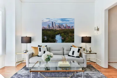 Aerial view of the Austin skyline at sunset over Barton Springs. Reproduction
