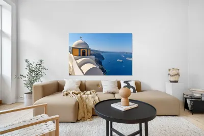 Santorinis iconic church and caldera with ships. Reproduction