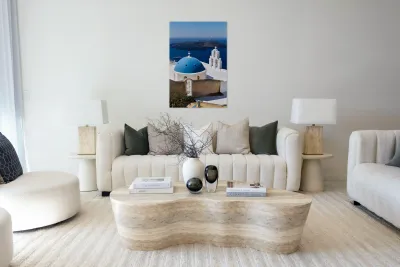 Santorinis iconic blue dome church and caldera seascape. Reproduction