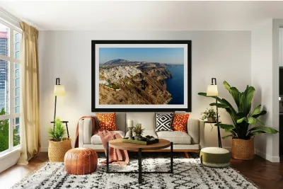 Santorinis white buildings on caldera cliffs above the sea. Reproduction