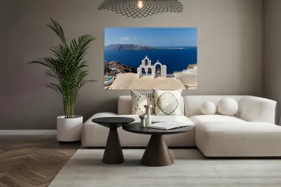 Iconic Santorini bell tower overlooking the caldera and Aegean S Reproduction