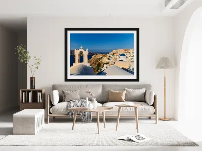 Santorini village with church bell tower overlooking caldera. Reproduction