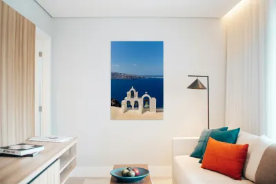 Santorini bell tower overlooking the Aegean Sea. Reproduction