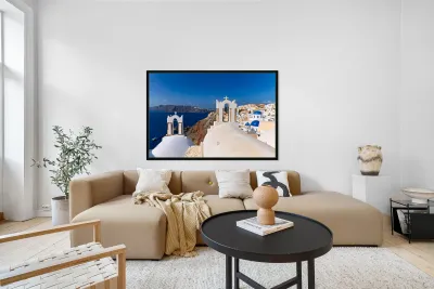 Santorinis iconic white churches blue domes and caldera view. Reproduction