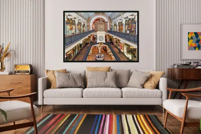 Elegant Victorian shopping arcade with clock tower and shoppers. Reproduction