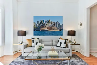 Sydney Opera House and city skyline on a clear day. Reproduction