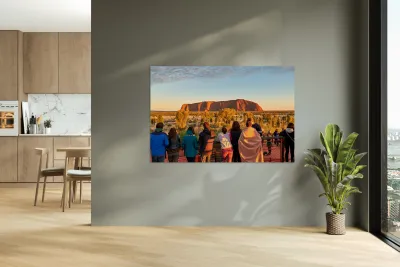 Tourists watch Uluru glow at sunrise. Reproduction