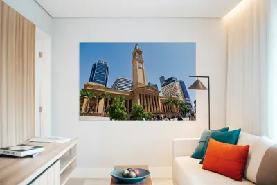 Brisbane City Hall with modern buildings and palm trees. Reproduction