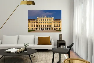 Ornate yellow palace facade with people and blue sky. Reproduction