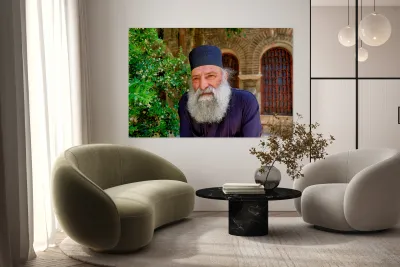 Elderly man with a beard poses near a historical building in a g Reproduction