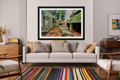 Ancient temple ruins consumed by giant tree roots and jungle. Reproduction