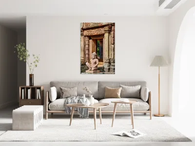 Ancient Cambodian temple with intricate carvings and stone statu Reproduction