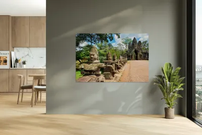 Ancient stone statues line path to Angkor Thom gate. Reproduction